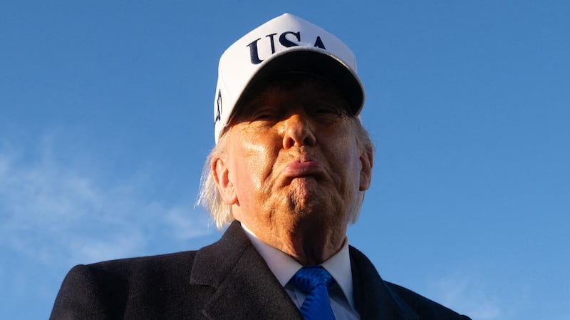 US President Donald Trump speaks to reporters before boarding Air Force One as he departs Joint Base Andrews in Maryland on March 13, 2026. President Trump is heading to Florida to spend the weekend at his Mar-a-Lago resort. (Photo by SAUL LOEB / AFP via Getty Images)