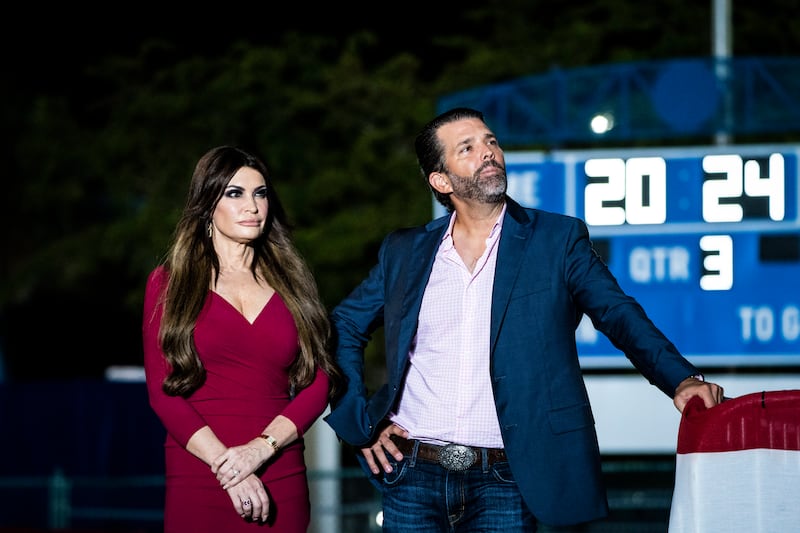 Hialeah, FL - November 8 : Donald Trump, Jr. and Kimberly Guilfoyle listen as former President Donald Trump speaks at a campaign rally on Wednesday, Nov. 08, 2023, in Hialeah, FL. (Photo by Jabin Botsford/The Washington Post via Getty Images)