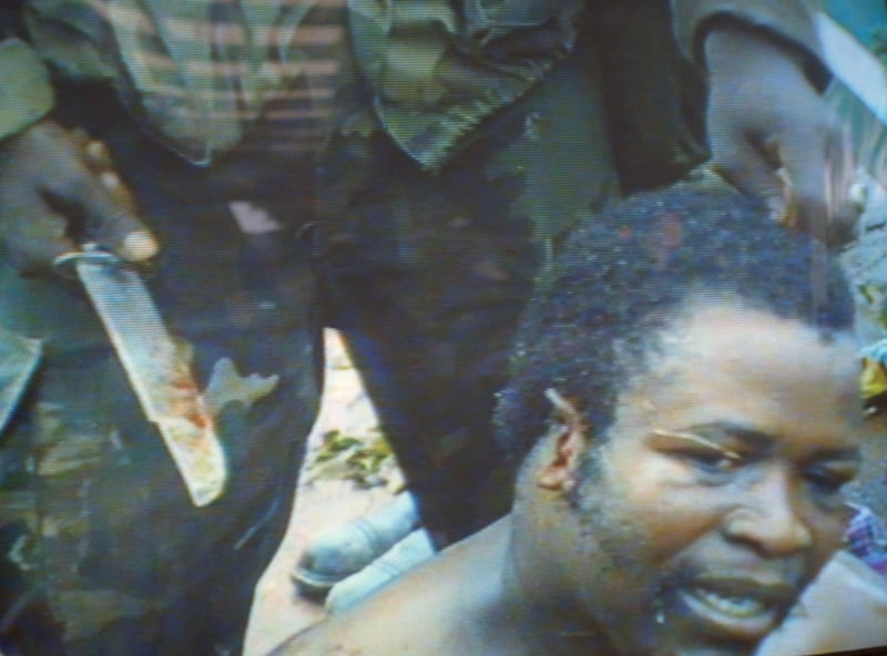 galleries/2012/04/26/charles-taylor-verdict-liberian-warlord-s-alleged-atrocities-photos/liberia-samuel-doe-torture-1990_wdqu23