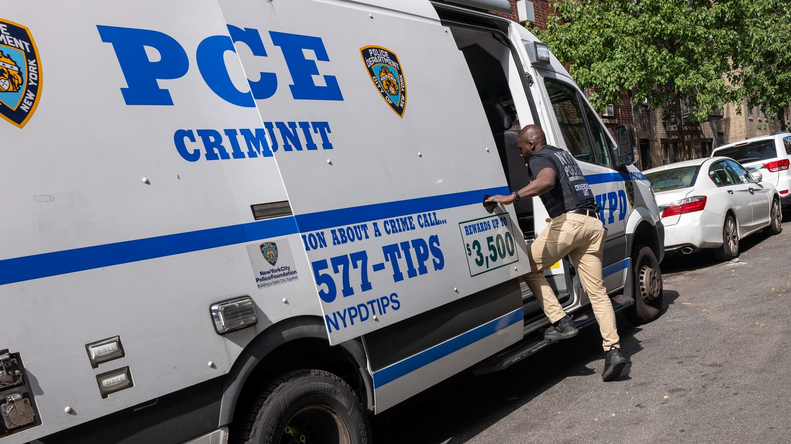 Police and crime scene investigators work at a Bronx day care center, after a 1-year-old child died and three other children were injured from alleged exposure to the drug fentanyl