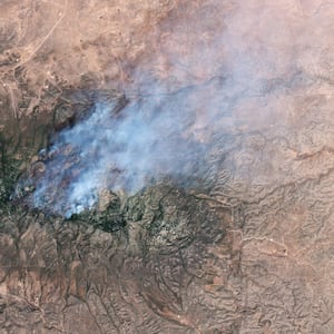 NEW MEXICO, USA - 17 MAY 2026: Satellite view of the Seven Cabins fire in the Capitan Mountain Wilderness, New Mexico. The blaze, which erupted on May 14 after a Trans Aero MedEvac medical transport plane crashed along its flightpath from Roswell to Sierra Blanca Regional Airport, has scorched nearly 9,000 acres and remains uncontained, sending thick smoke plumes across Lincoln County. Imaged 17 May 2026. (Photo by Gallo Images/Orbital Horizon/Copernicus Sentinel Data 2026)