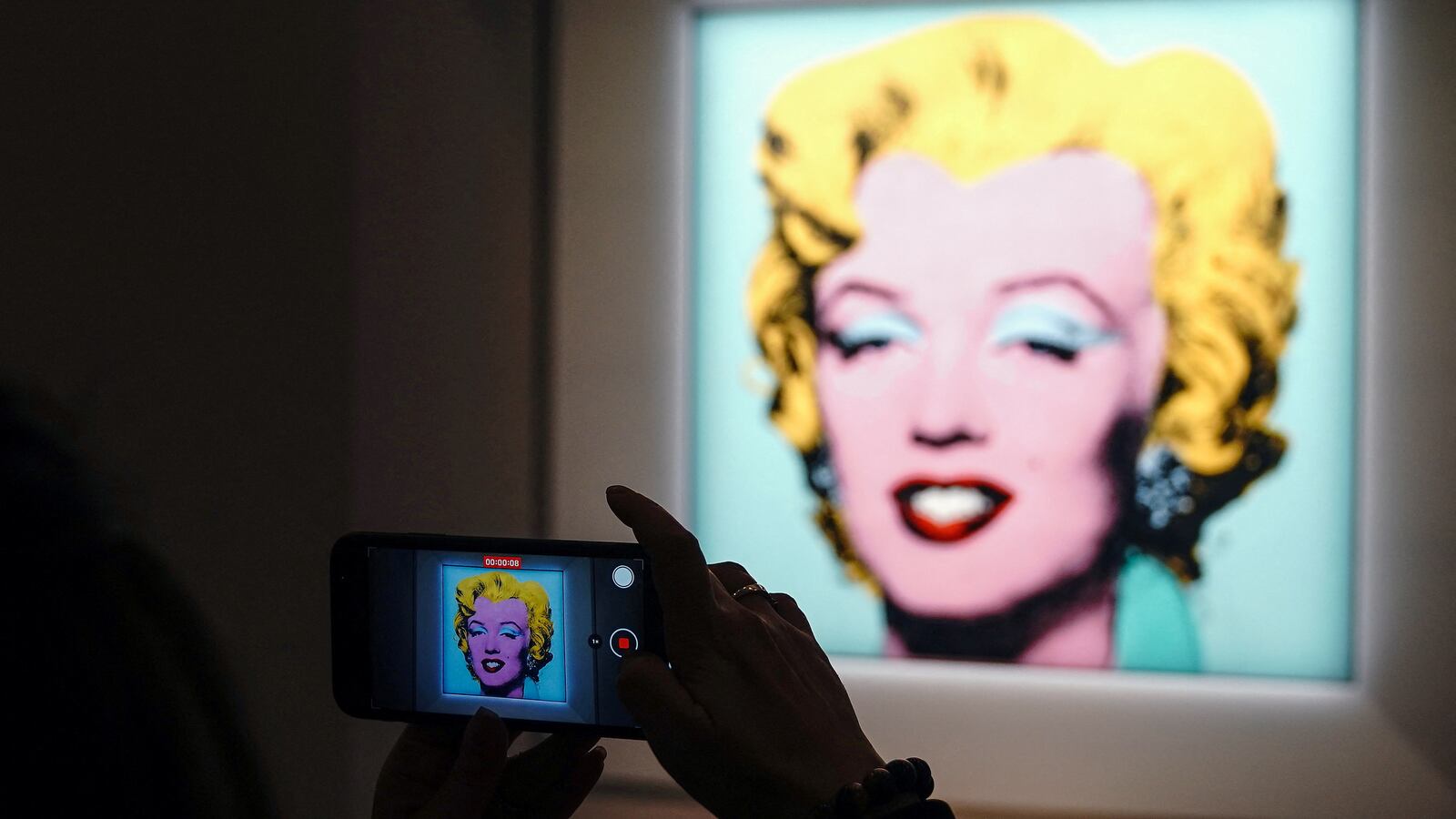Andy Warhol's "Shot Sage Blue Marilyn", a painting of Marilyn Monroe, is pictured on display at Christie's Auction House.