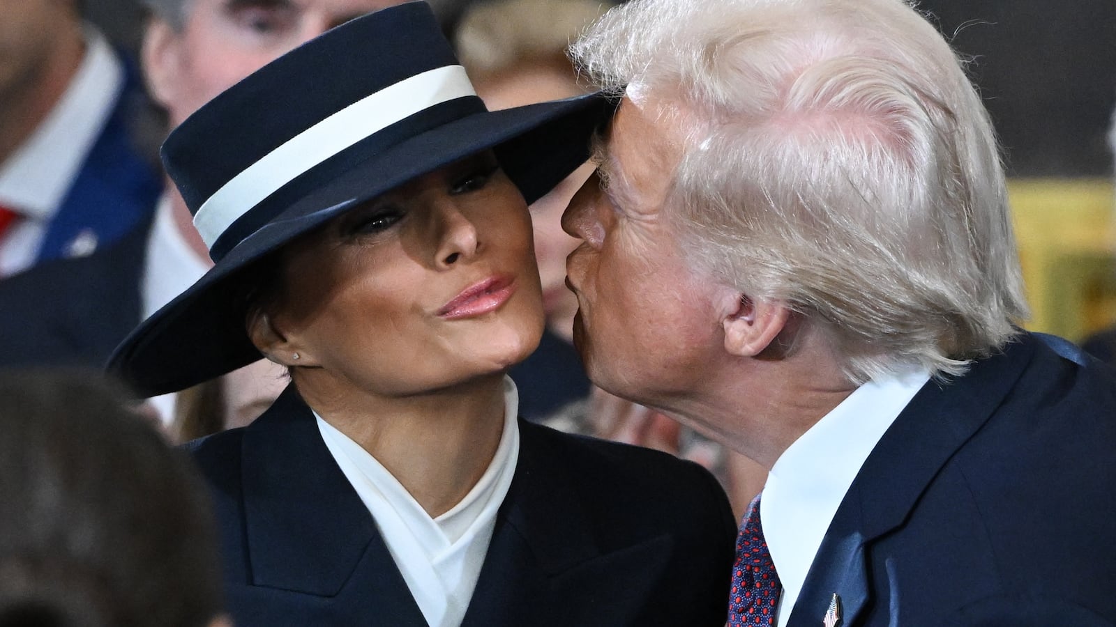 WASHINGTON, DC - JANUARY 20: U.S. President-elect Donald Trump kisses Melania Trump at his inauguration in the U.S. Capitol Rotunda on January 20, 2025 in Washington, DC. Donald Trump takes office for his second term as the 47th President of the United States. (Photo by Saul Loeb-Pool/Getty Images)
