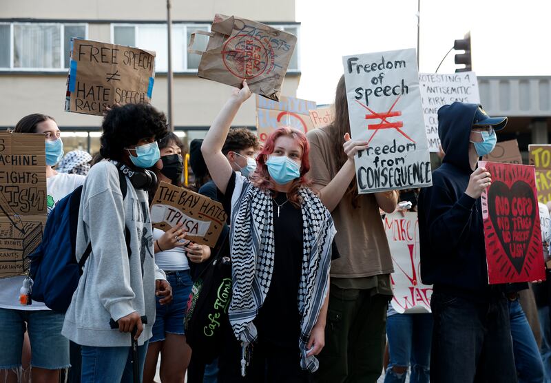 BERKELEY, CALIFORNIA - NOVEMBER 10: Protesters hold signs as they demonstrate outside of a Turning Point USA event at the University of California, Berkeley (UC Berkeley) on November 10, 2025 in Berkeley, California. Two months after Turning Point USA founder Charlie Kirk was killed, the tour made a stop in California at UC Berkeley. (Photo by Justin Sullivan/Getty Images)