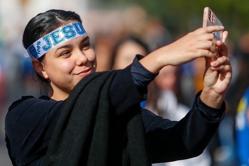 A believer poses for a selfie during the "March for Jesus", an event that gathers a wide range of evangelical congregations, in Sao Paulo, Brazil on May 30, 2024.