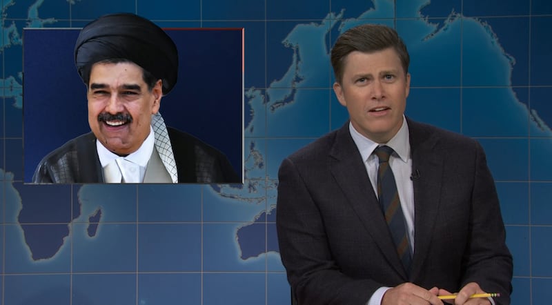 SNL, Colin Jost with photoshopped picture of Nicolas Maduro. (NBC)