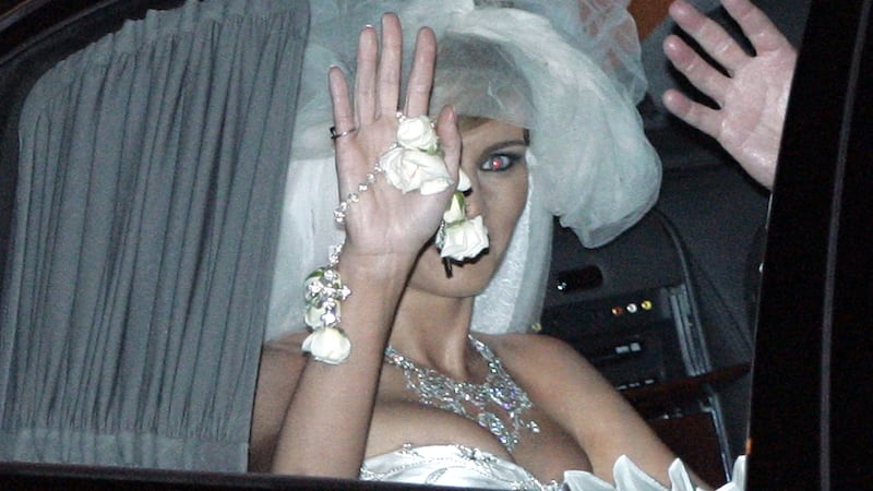 Donald Trump's new bride, Slovenian model Melania Knauss, waves as they leave the Bethesda-by-the-Sea Episcopal Church after their wedding in Palm Beach, Florida, January 22, 2005.