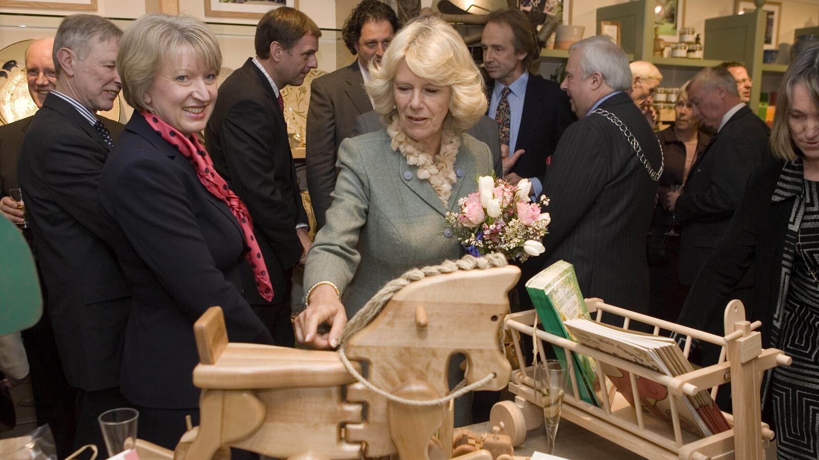 TETBURY - MARCH 17: (NO PUBLICATION IN UK MEDIA FOR 28 DAYS) Camilla, Duchess of Cornwall looks at childrens toys as she opens the new Highgrove shop on March 17, 2008 in Tetbury, England.