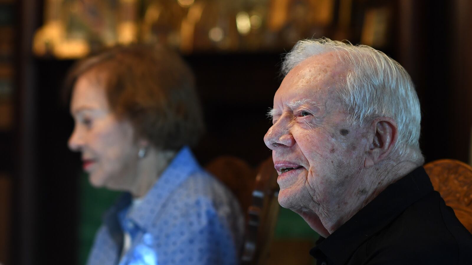 Jimmy Carter sits next to his wife, former First Lady, Rosalynn Carter