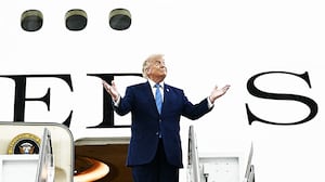 US President Donald Trump steps out of the new Air Force One,