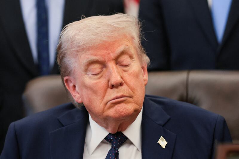 President Donald Trump reacts during a healthcare affordability event in the Oval Office at the White House in Washington, D.C., U.S., April 23, 2026.