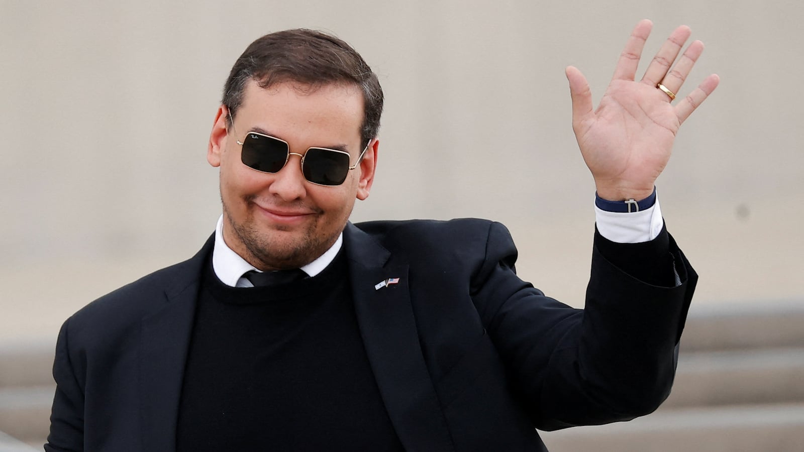 George Santos (R-NY) gestures, as he walks outside the Central Islip Federal Courthouse