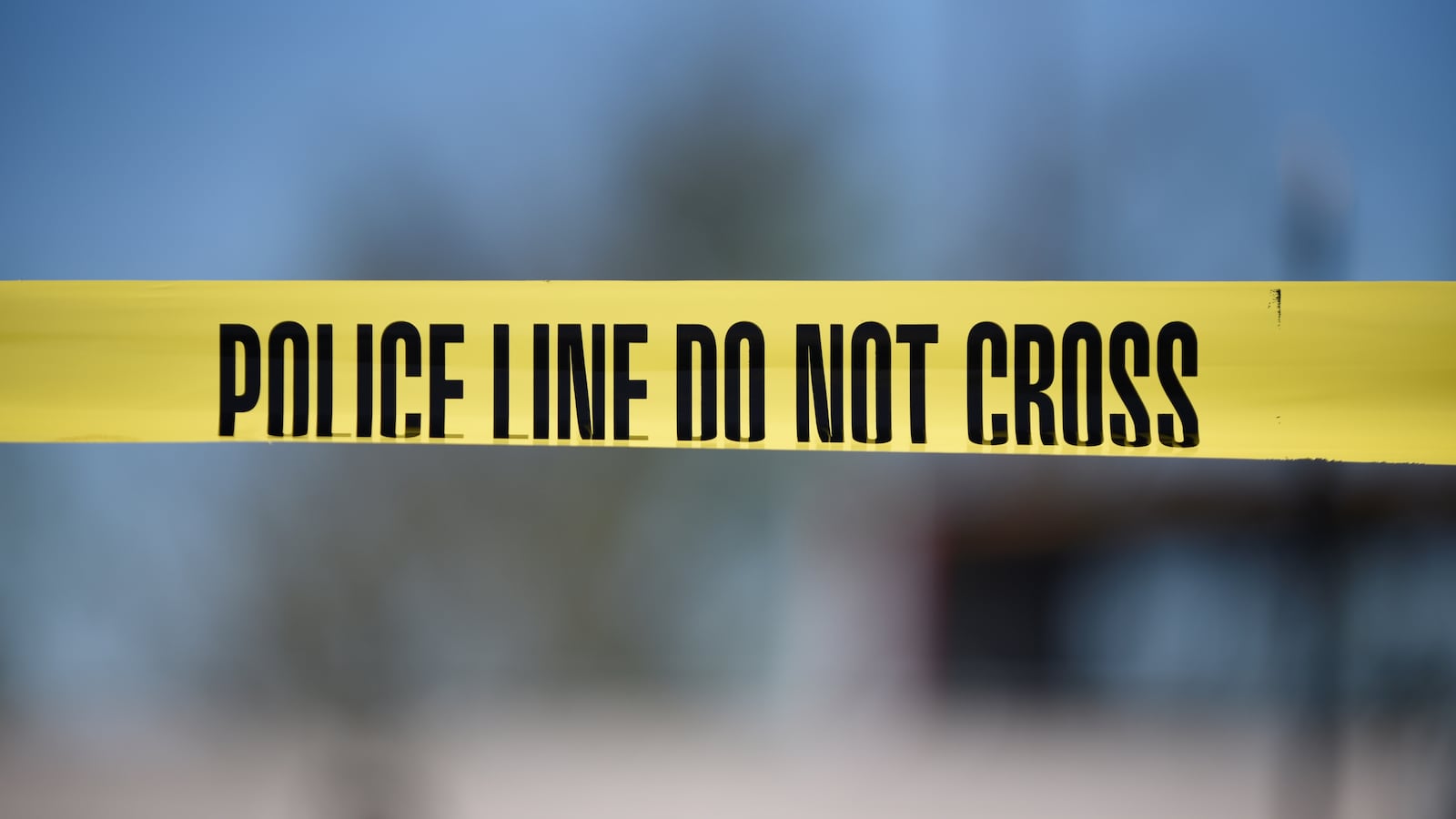 Crime scene tape saying "Police line do not cross"