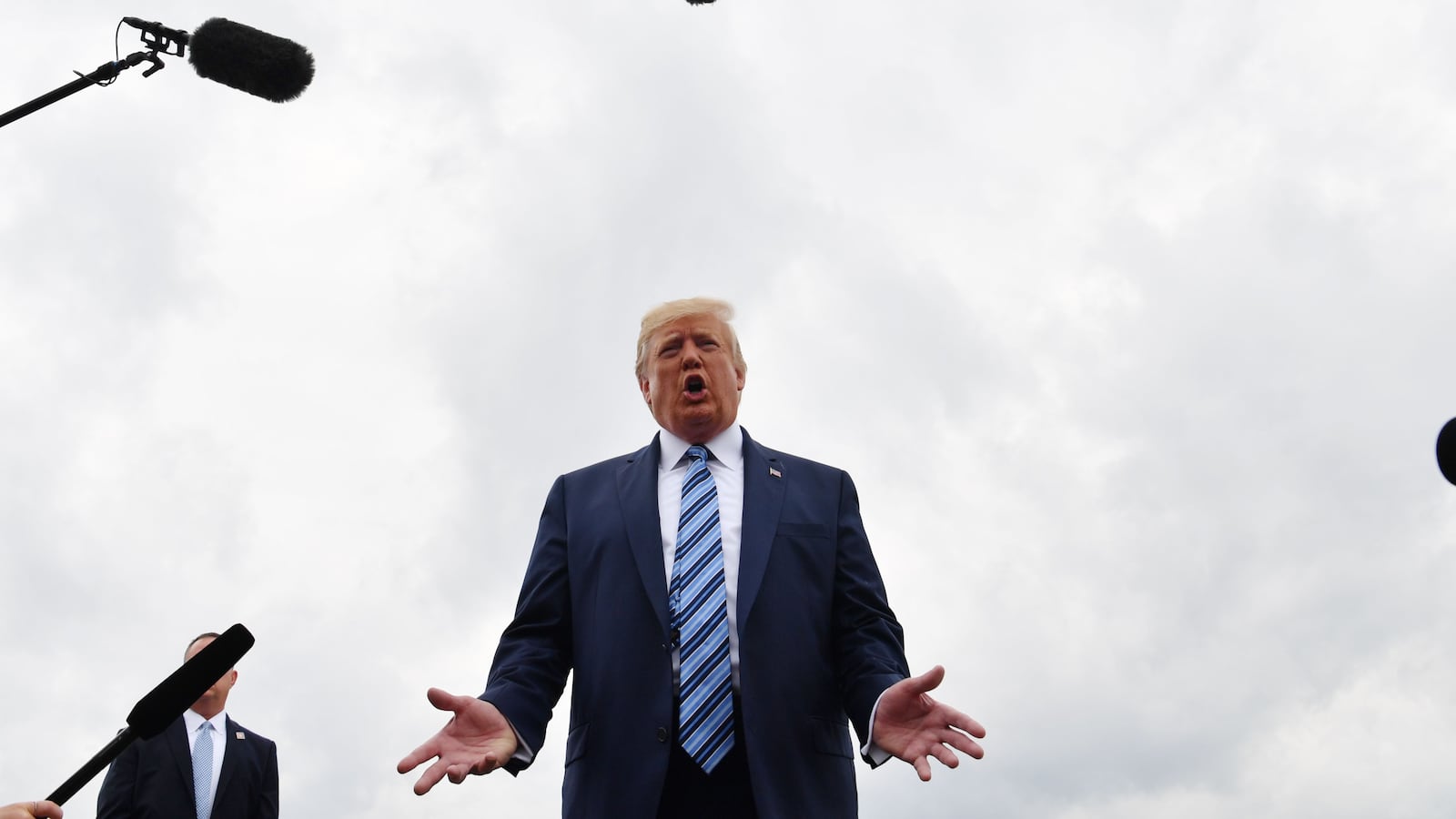 US President Donald Trump speaks to the press at Morristown Municipal Airport in Morristown, New Jersey, on August 13, 2019 as he departs for Pennsylvania where he will visit the Shell Pennsylvania Petrochemicals Complex. (Photo by Nicholas Kamm / AFP) (Photo credit should read NICHOLAS KAMM/AFP via Getty Images)