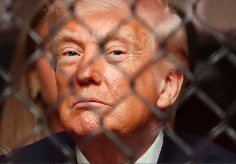 U.S. President Donald Trump watches a match during the UFC 327 event at Kaseya Center in Miami, Florida, U.S., April 11, 2026.  REUTERS/Kevin Lamarque      TPX IMAGES OF THE DAY
