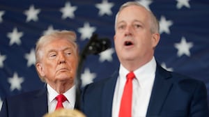 FORT BRAGG, NORTH CAROLINA - FEBRUARY 13: U.S. President Donald Trump listens as Michael Whatley, former Republican National Committee Chairman and current candidate for US Senate in North Carolina, speaks during a visit to the Fort Bragg U.S. Army base on February 13, 2026 in Fort Bragg, North Carolina. Trump visited the base to honor special forces involved in the military operation in Venezuela in early 2026. (Photo by Nathan Howard/Getty Images)
