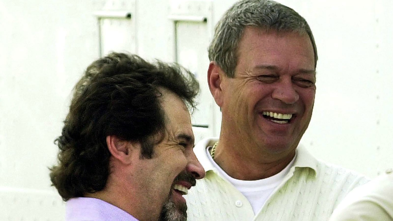 Dennis Miller (L) talks with Monday Night Football producer Don Ohlmeyer