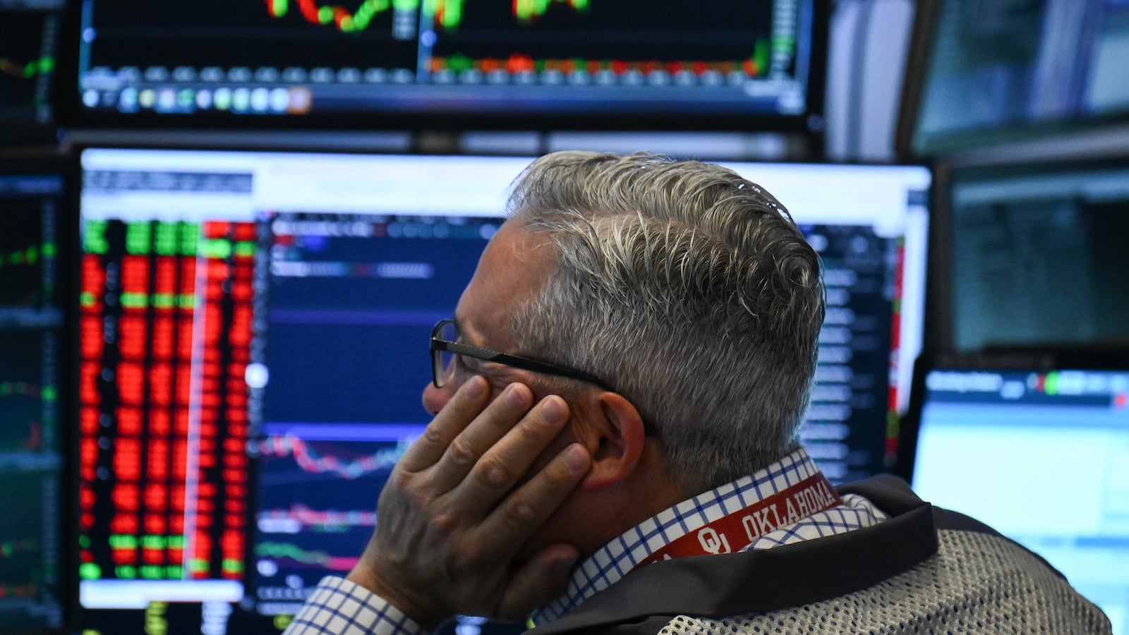 A trader works on the floor of the New York Stock Exchange (NYSE) at the opening bell on June 13, 2025, in New York City. Oil prices soared and stocks sank Friday after Israel launched strikes on nuclear and military sites in Iran, stoking fears of a full-blown war. (Photo by ANGELA WEISS / AFP) (Photo by ANGELA WEISS/AFP via Getty Images)