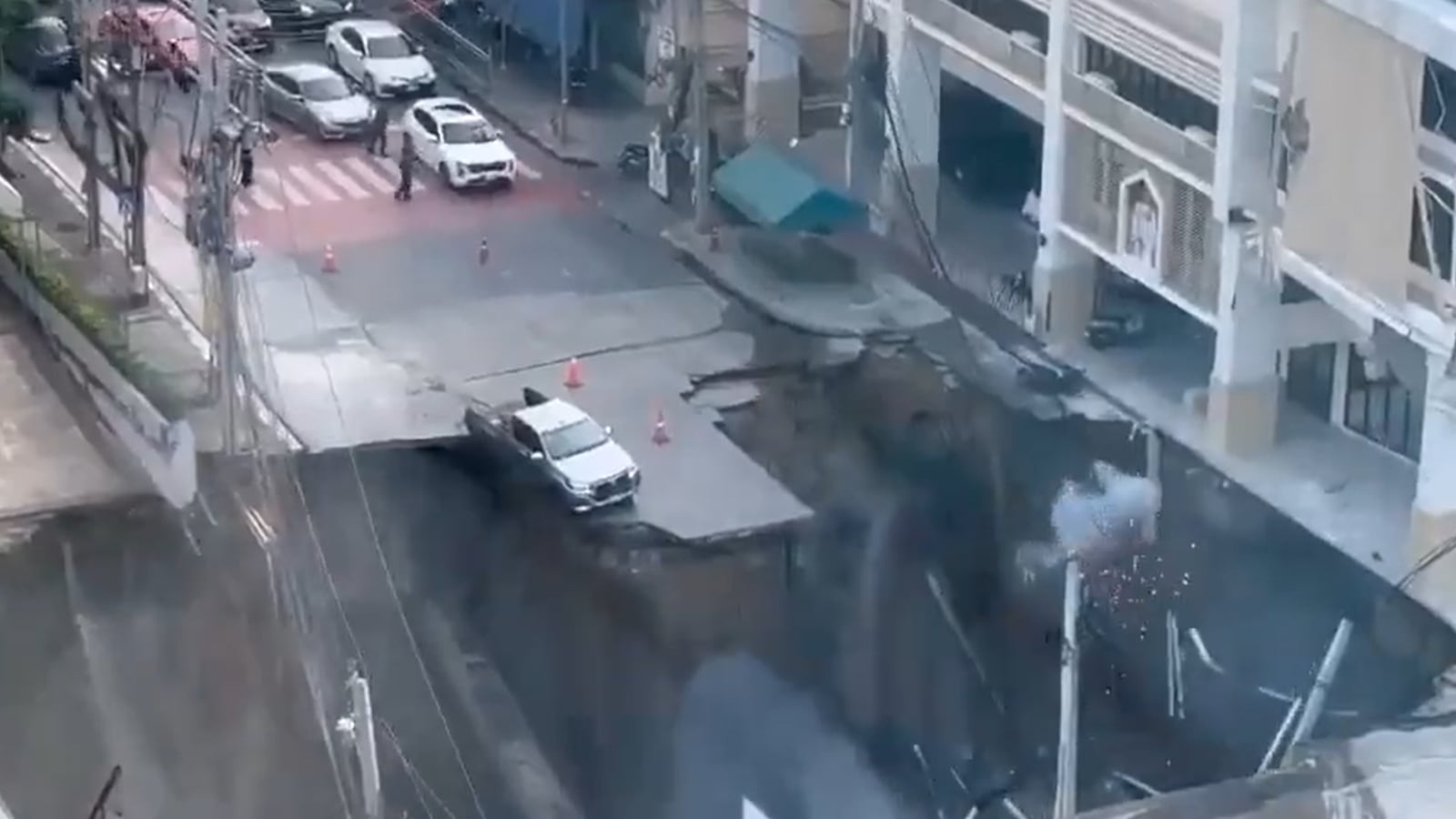 Giant Sinkhole Swallows Three Cars in Middle of Highway