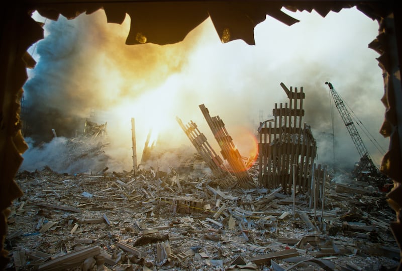The rubble of the World Trade Center smolders following a terrorist attack September 11, 2001 in New York.