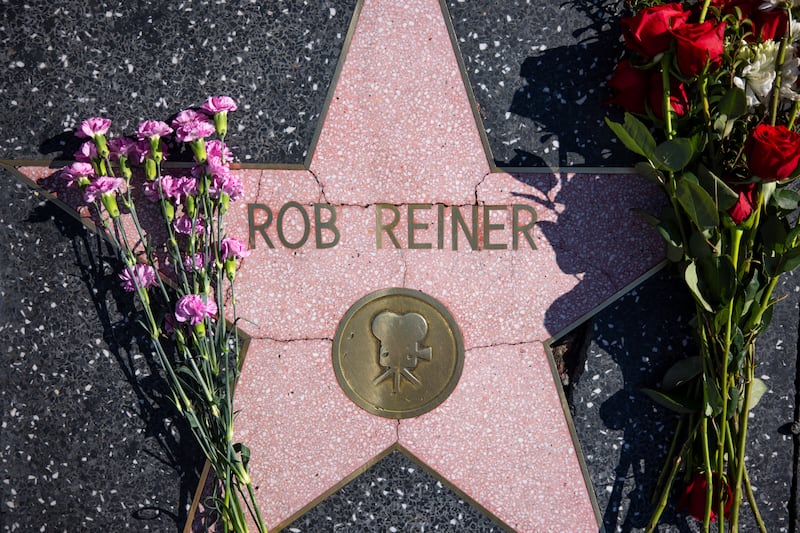 Flowers are seen placed on top of Rob Reiner's Hollywood Walk of Fame Star on Monday, Dec. 15, 2025.