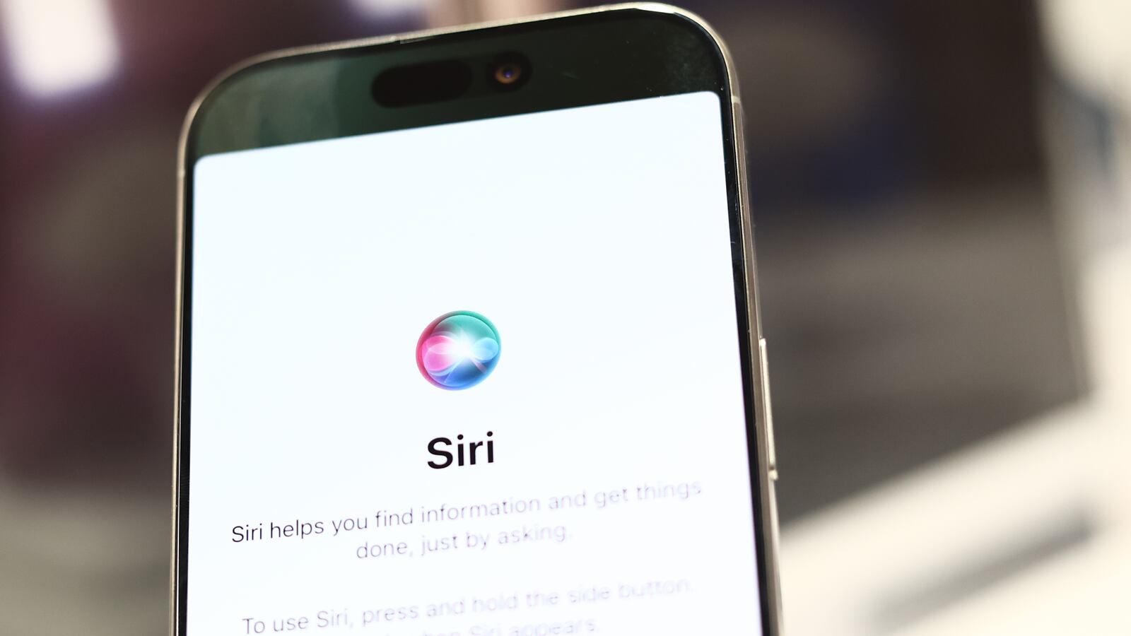 Siri logo is seen on a phone screen in this illustration photo taken in the store in Krakow, Poland on September 26, 2024. (Photo by Jakub Porzycki/NurPhoto via Getty Images)