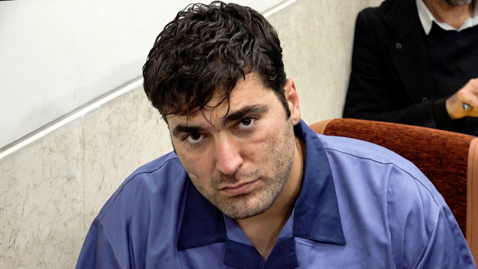Majid Kazemi appears in a courtroom as he, Saeid Yaghoubi, and Saleh Mirhashemi are alleged to have killed members of security forces in Isfahan, Iran, Jan. 9, 2023.