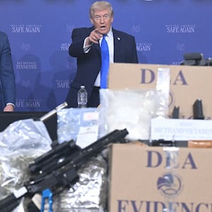 US President Donald Trump, flanked by Defense Secretary Pete Hegseth and Attorney General Pam Bondi, participates in his Memphis Safe Task Force anti-crime initiative roundtable in Memphis, Tennessee, on March 23, 2026. (Photo by SAUL LOEB / AFP via Getty Images)