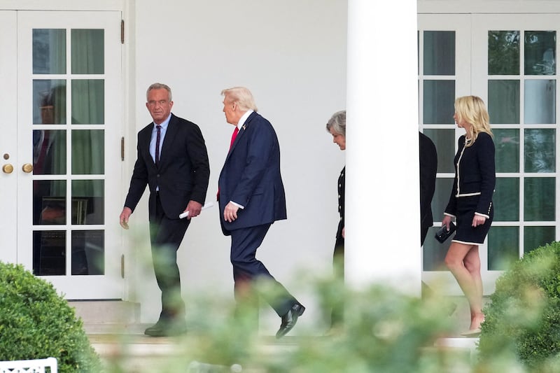 U.S. President Donald Trump walks with U.S. Secretary of Health and Human Services Robert F. Kennedy Jr., White House Chief of Staff Susie Wiles and White House Aide Natalie Harp at the White House in Washington, D.C., U.S., September 30, 2025.