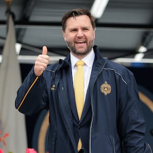 Vice President JD Vance is gifted a jacket during the 2025 Naval Academy Graduation