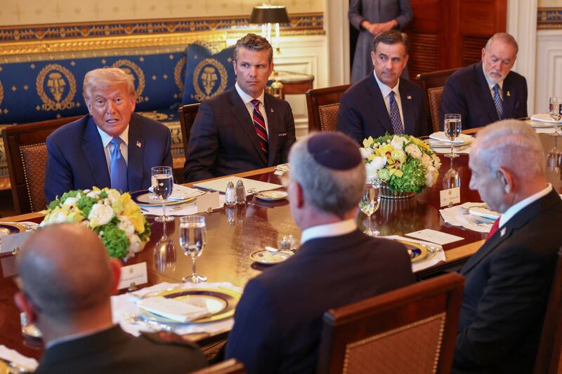 U.S. President Donald Trump speaks during a bilateral dinner with Israeli Prime Minister Benjamin Netanyahu, as U.S. Defense Secretary Pete Hegseth looks on, at the White House in Washington, D.C., U.S., July 7, 2025. REUTERS/Kevin Lamarque
