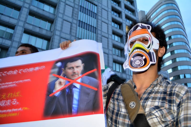 galleries/2013/09/02/president-obama-s-syria-decision-making-photos/130901-syria-protest-japan_oxv1qj