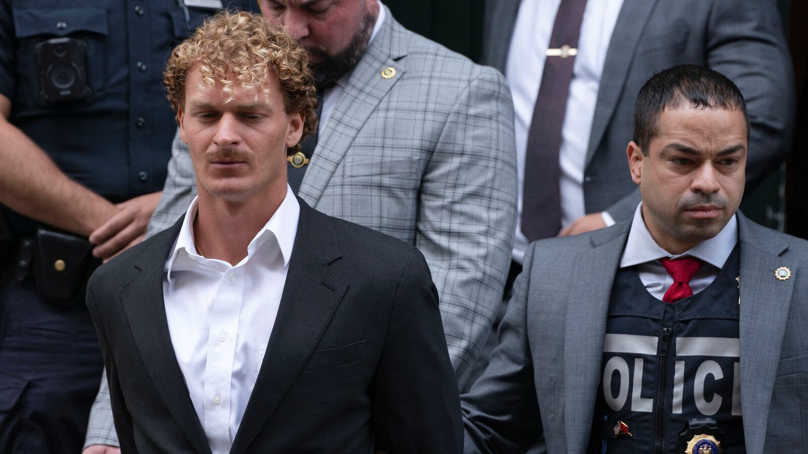 Former U.S. Marine Daniel Penny is taken from a New York City Police precinct under arrest for the death of Jordan Neely.