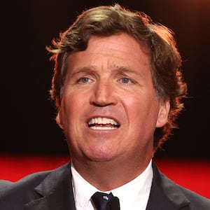 US political commentator Tucker Carlson speaks during the public memorial service for right-wing activist Charlie Kirk at State Farm Stadium in Glendale, Arizona, on September 21, 2025.
