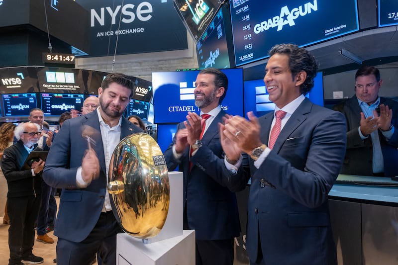 Trump Jr. stands on the floor of the New York Stock Exchange last July after ringing the opening bell for GrabAGun.