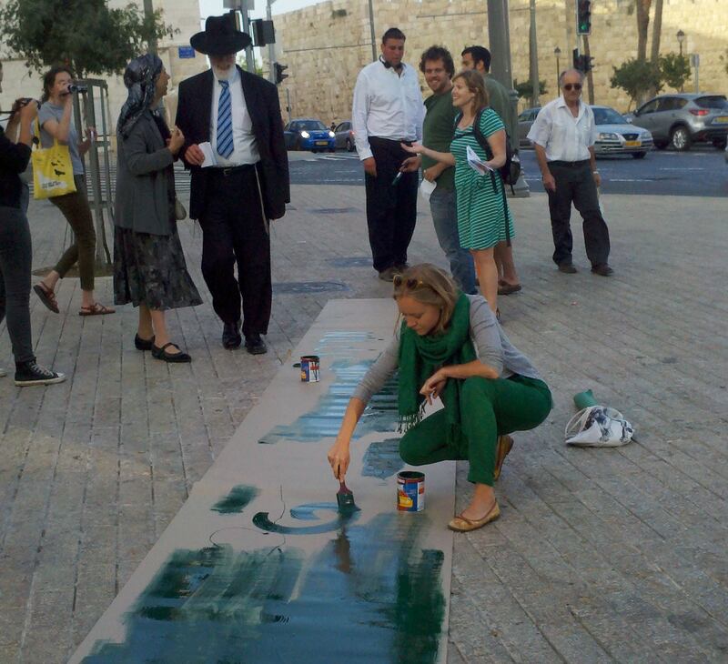 articles/2013/06/05/painting-a-green-line-through-jerusalem4/green-line-painting-openz_kvdwvk
