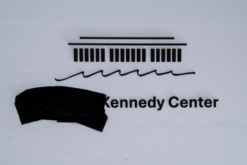 A close up view of a sign for The Trump Kennedy Center with its official logo with black tape covering "Trump" on January 17, 2026, outside The Trump Kennedy Center in Washington, DC.