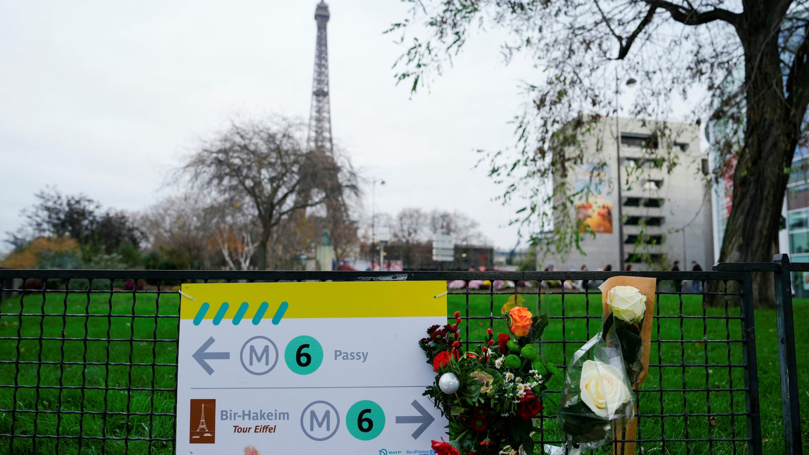 Flowers where a tourist was stabbed to death near the Eiffel Tower