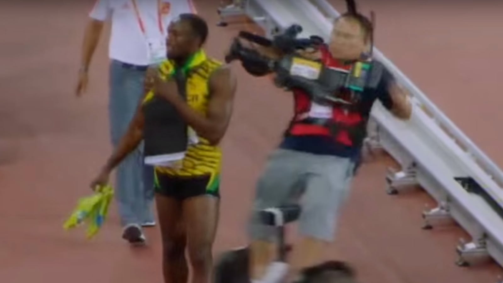 videos/2015/08/27/usain-bolt-wins-200m-race-cameraman-trips-him/150827-viralvid-bolt-tease_qqm4yo