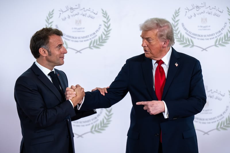 14 October 2025, Egypt, Scharm El Scheich: US President Donald Trump (r) takes part in the Gaza summit chaired by Egypt's President Al-Sisi alongside Emmanuel Macron, President of France. Photo: Michael Kappeler/dpa (Photo by Michael Kappeler/picture alliance via Getty Images)