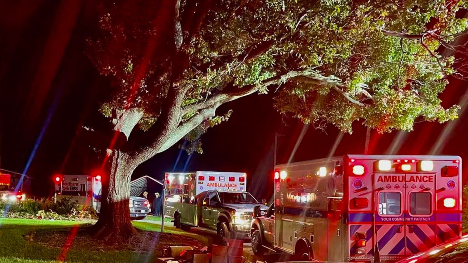 Ambulances are pictured parked outside a scene where local Pennsylvania officials say an Amish family was attended to after they ate toxic mushrooms.