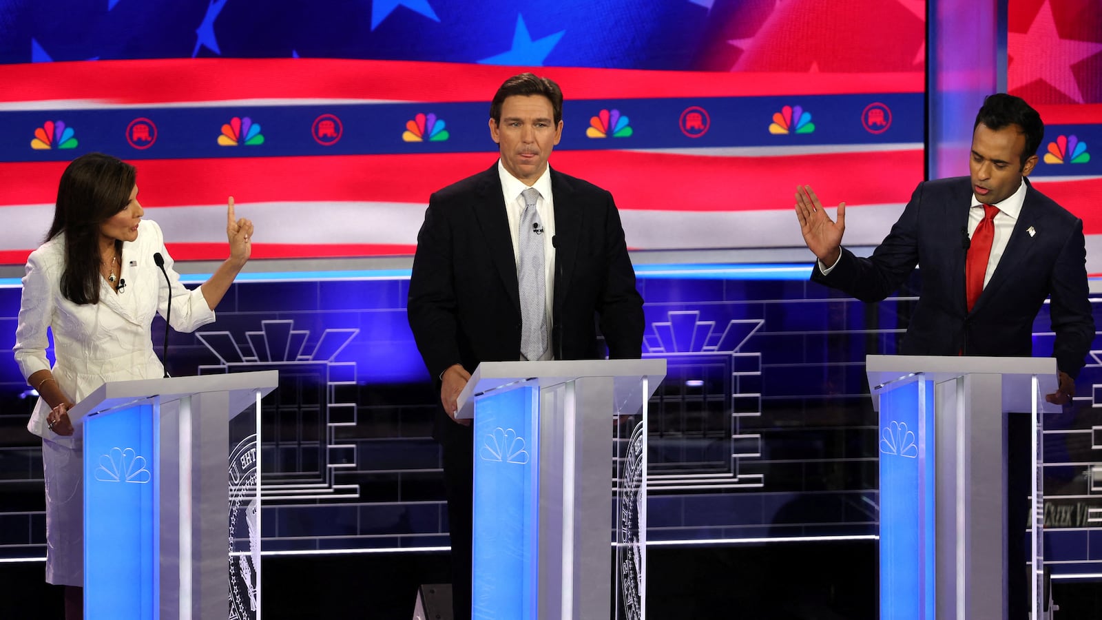 Ron DeSantis stands between Nikki Haley and Vivek Ramaswamy at the third Republican candidates’ presidential debate of the 2024 presidential campaign in Miami, Florida, Nov. 8, 2023.