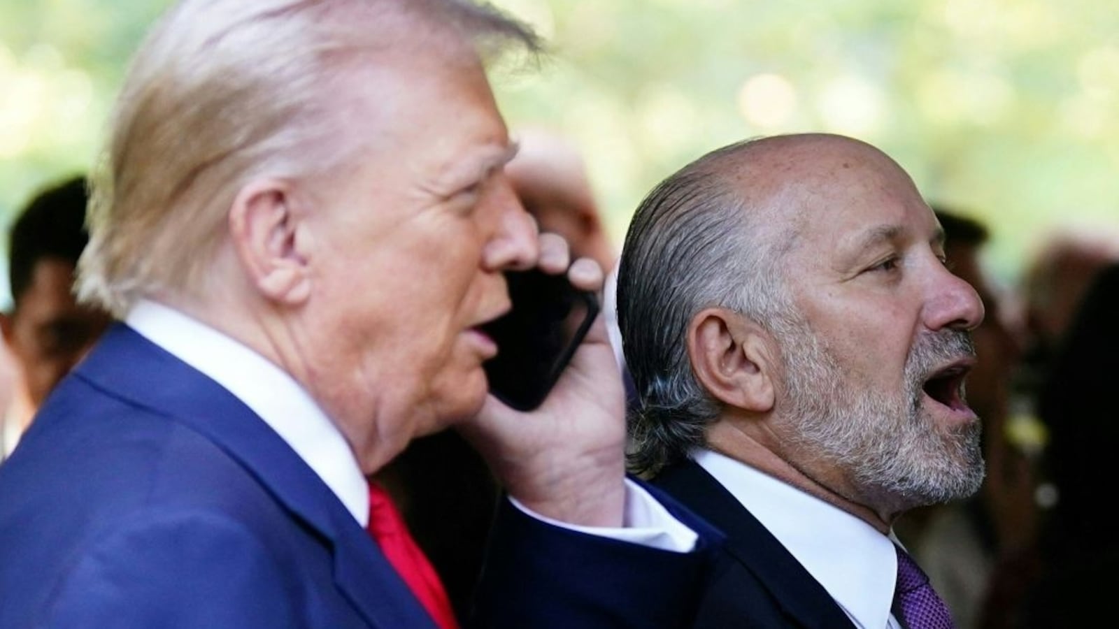 Howard Lutnick, CEO of Cantor Fitzgerald, speaks with President-elect Donald Trump.