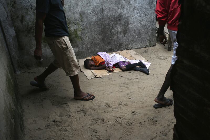 articles/2014/11/08/the-photojournalist-who-stared-down-ebola/141107-haglage-ebola-embed2_stfnep