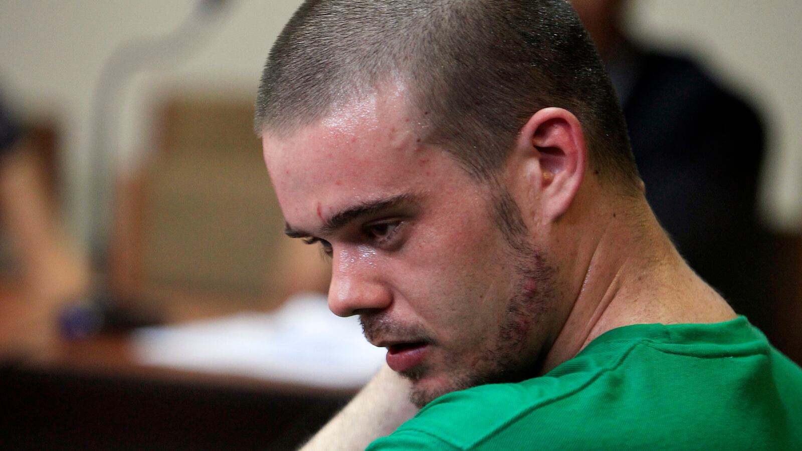Joran Van der Sloot sweats while sitting in the courtroom during the reading of his verdict in the Lurigancho prison in Lima January 13, 2012.