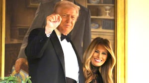 Donald Trump and first lady Melania Trump arrive at the Congressional Ball at the Grand Foyer of the White House on December 11, 2025 in Washington, DC.