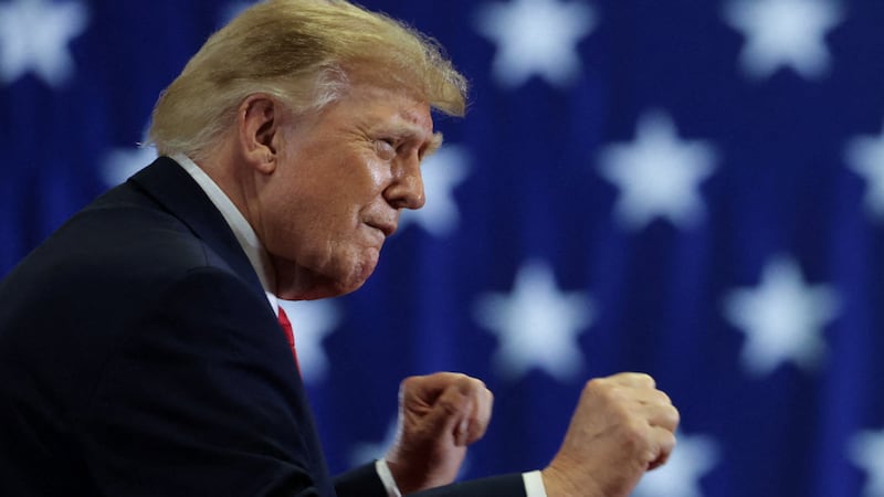 Donald Trump puts up his dukes in a midterm election rally for Oklahoma Republican gubernatorial candidate Mike Mazzei in Durant, Oklahoma.
