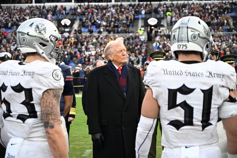 US President Donald Trump looks on before the college football game between the US Army and Navy at the M&T Bank Stadium in Baltimore, Maryland, on December 13, 2025.