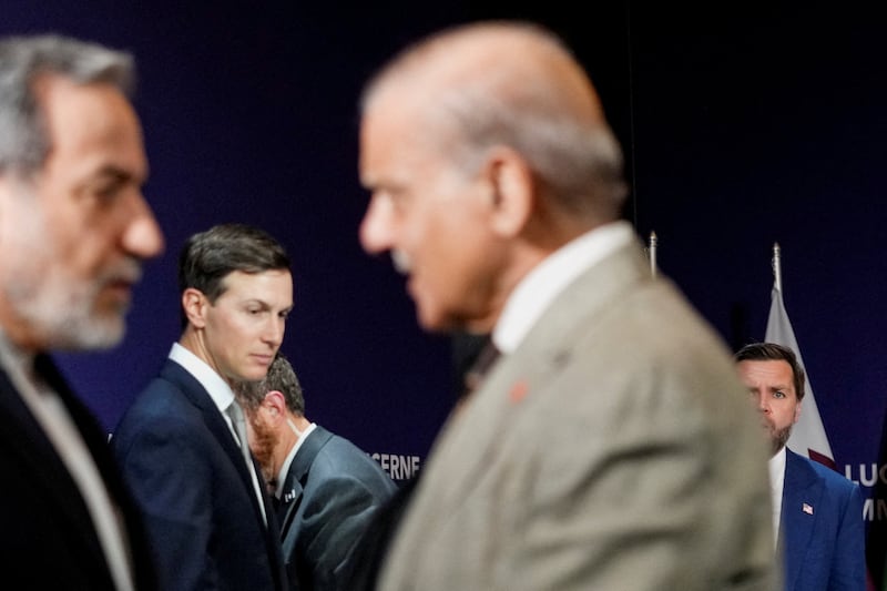 U.S. Vice President JD Vance looks on next to U.S. President Donald Trump's son-in-law Jared Kushner, as Iran's Foreign Minister Abbas Araqchi shakes hands with Pakistan's Prime Minister Shehbaz Sharif, before the start of a quadrilateral meeting between the U.S., Iran, Pakistan, and Qatar at the Lake Lucerne Summit, aimed at advancing a deal to end the Middle East conflict, at Buergenstock Resort Lake Lucerne, near Stansstad, Switzerland, June 21, 2026. REUTERS/Nathan Howard/Pool      TPX IMAGES OF THE DAY