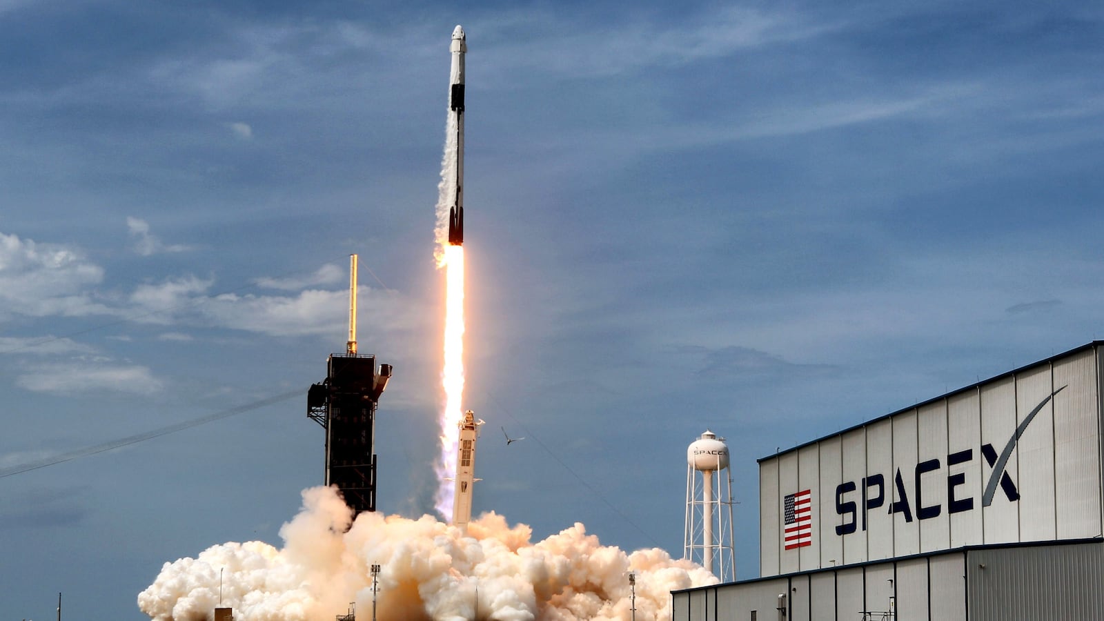 The SpaceX Falcon 9 rocket carrying astronauts Doug Hurley and Bob Behnken in the Crew Dragon capsule lifts off from Kennedy Space Center, Fla.
